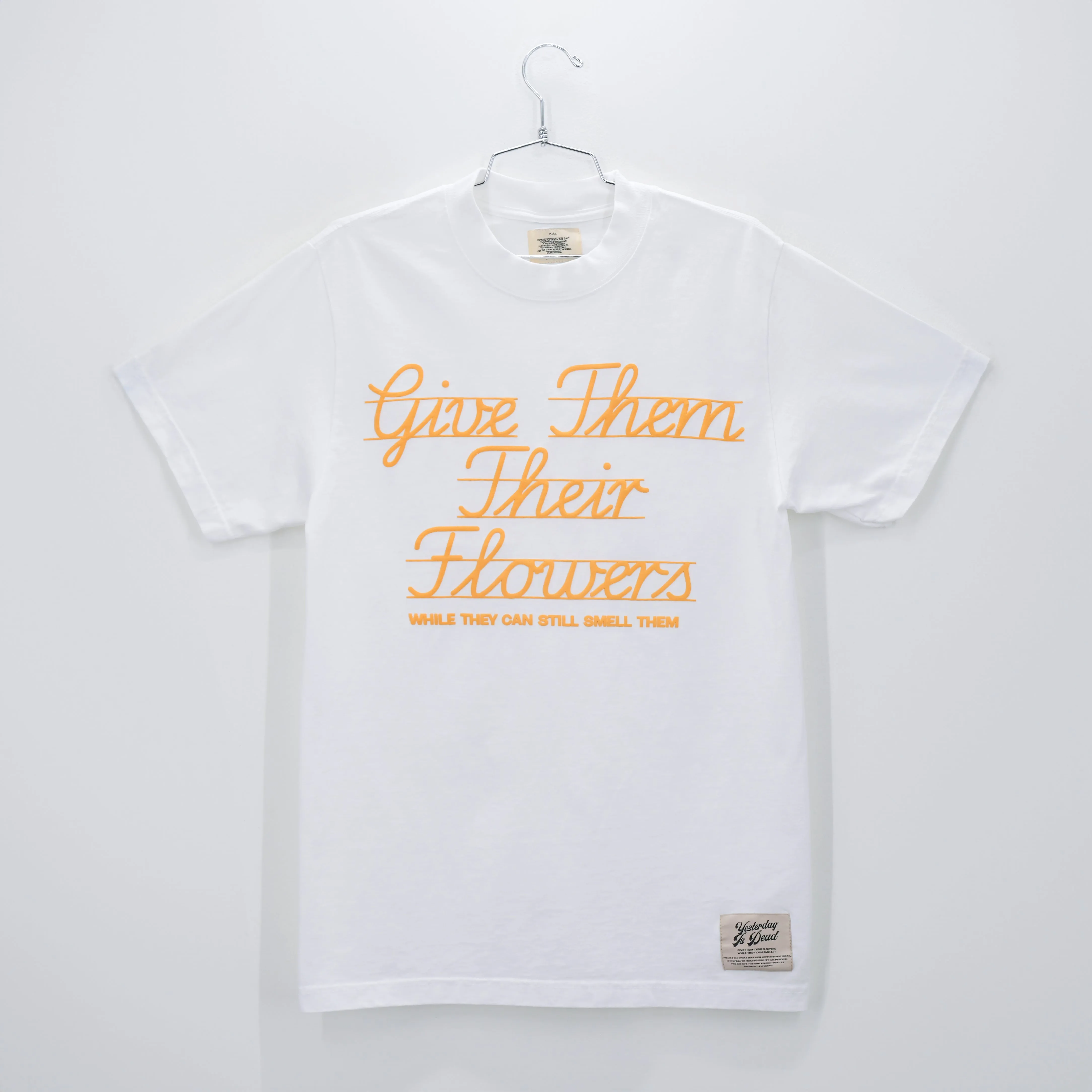 GIVE THEM THEIR FLOWERS SPELL OUT TEE WHITE